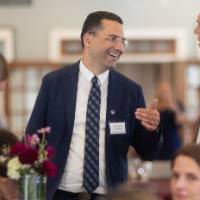 Marouane Kessentini speaking with peers